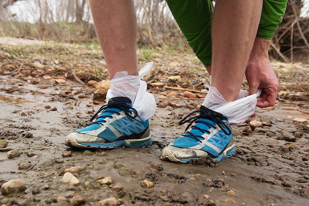 Pull on plastic bags like socks for instant waterproofing in wet conditions.