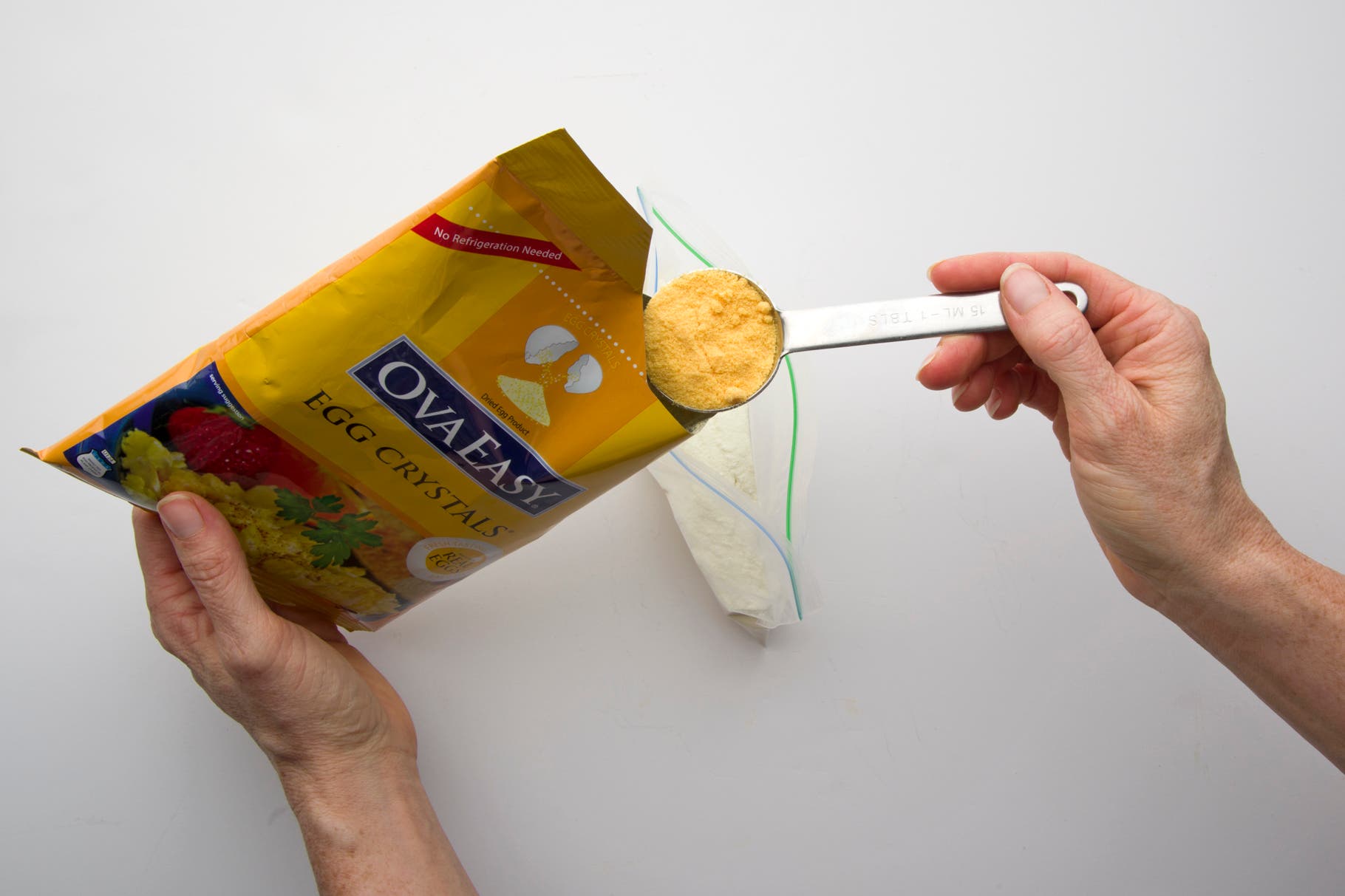 Add powdered milk and powdered eggs to a zip-top bag.