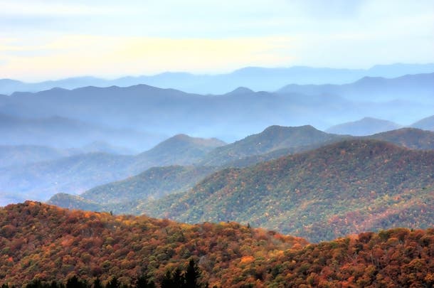 Great Smoky Mountains National Park, NC/TN Camp in a backcountry campsite or shelter in the Great Smoky Mountains to enjoy sweeping vistas of foggy-mountains covered in beautiful burnt oranges…