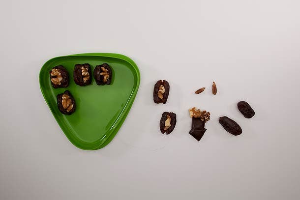 Trail Tapas: Step 2 Carefully split each date down the center (like a taco), then stuff each with a walnut and a chunk of chocolate. Store stuffed dates in a plastic…