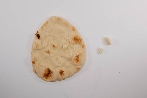 On the trail: Peel garlic and cut in half, then gently rub on each piece of bread.