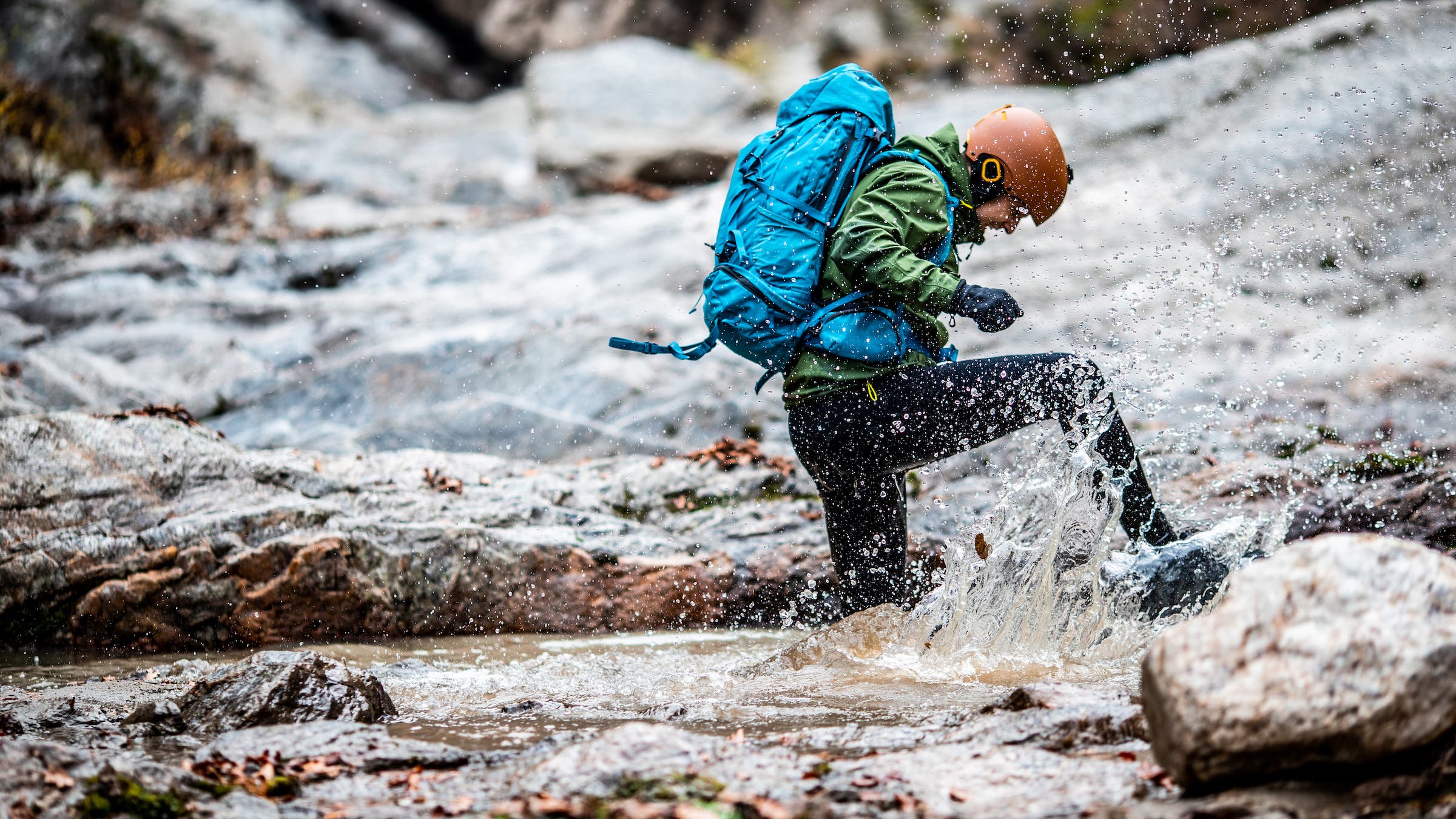 man crosses a river by running and jumping