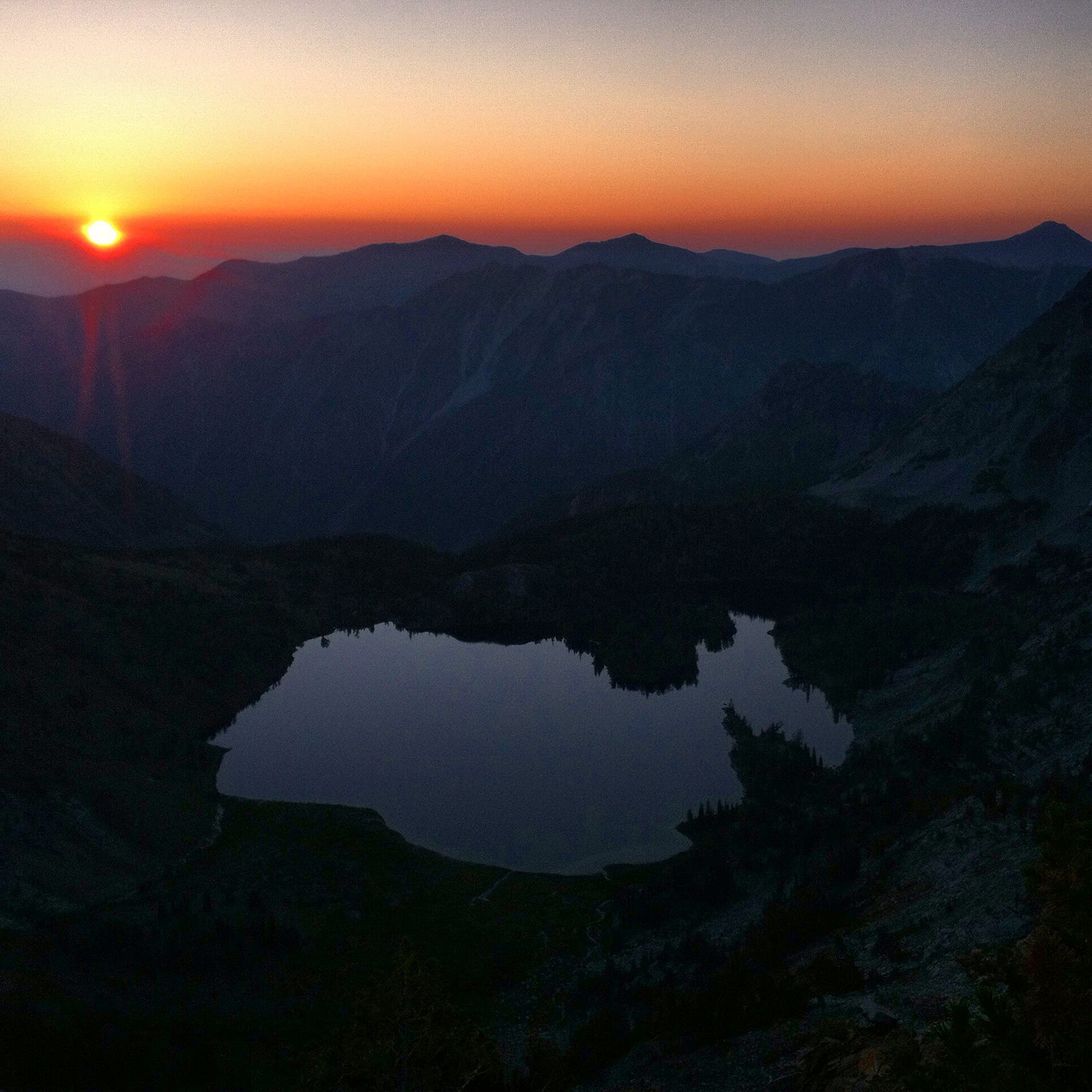 A forest fire sunrise over Ice Lake. Life as a Wilderness Ranger