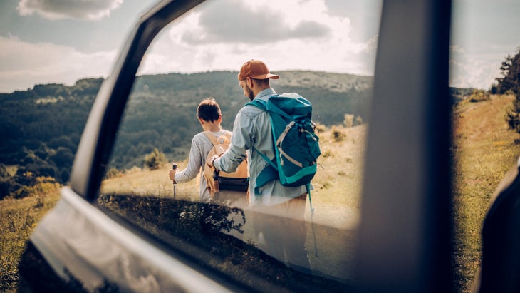 Hikers Seen Through Car Window