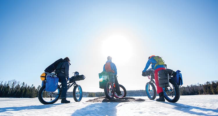 The team’s bikes were laden with cold-weather gear.