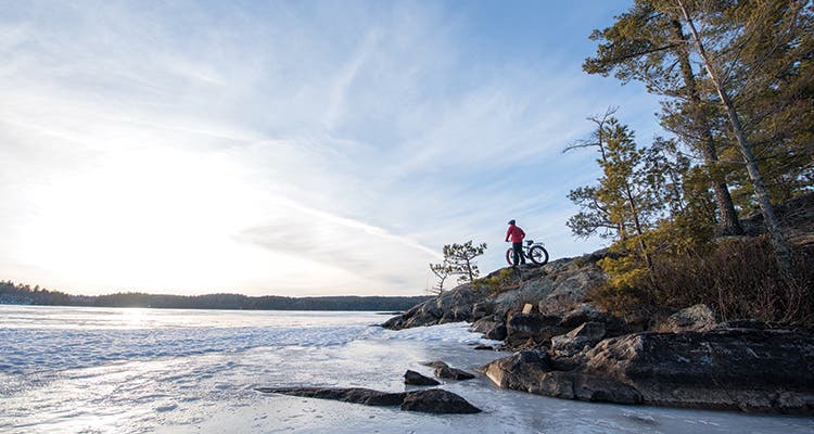 Man and bike prepare for movement without friction.