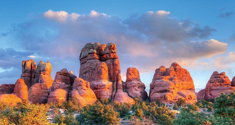 Afternoon sun sets the redrock aglow in Canyonlands National Park. Photo courtesy of istock.com/tonda