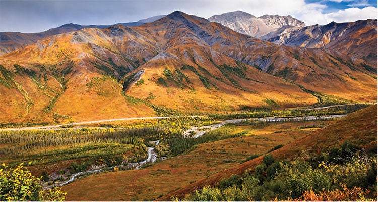 "The Dalton Highway, pictured here in the Brooks Range, generally runs parallel to the pipeline. Photo by Sunny Awazuhara-reed/firstlight.com"