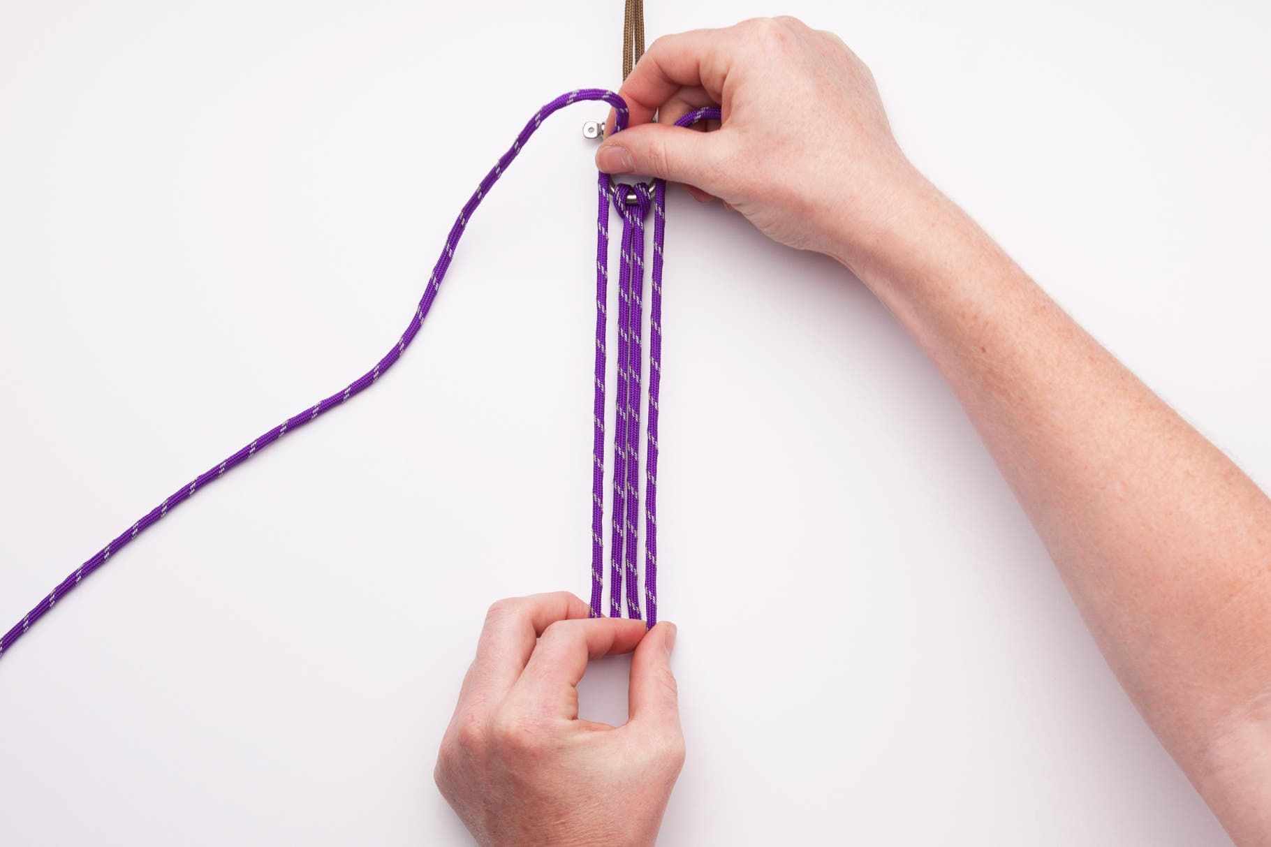 Measure how many inches long you want the bracelet to be. (In this case for a woman we measured six inches) Then proceed to fold the cord at that…