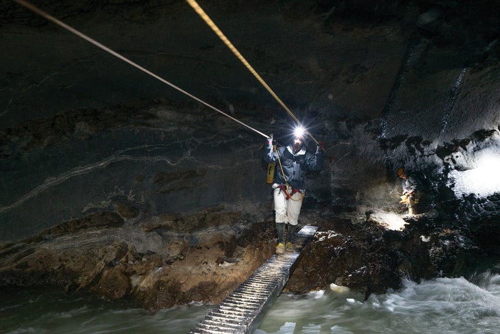 Wires and ropes provide safe passage across several of the cave’s rivers in Vietnam.
