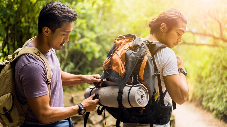 hikers adjusting gear