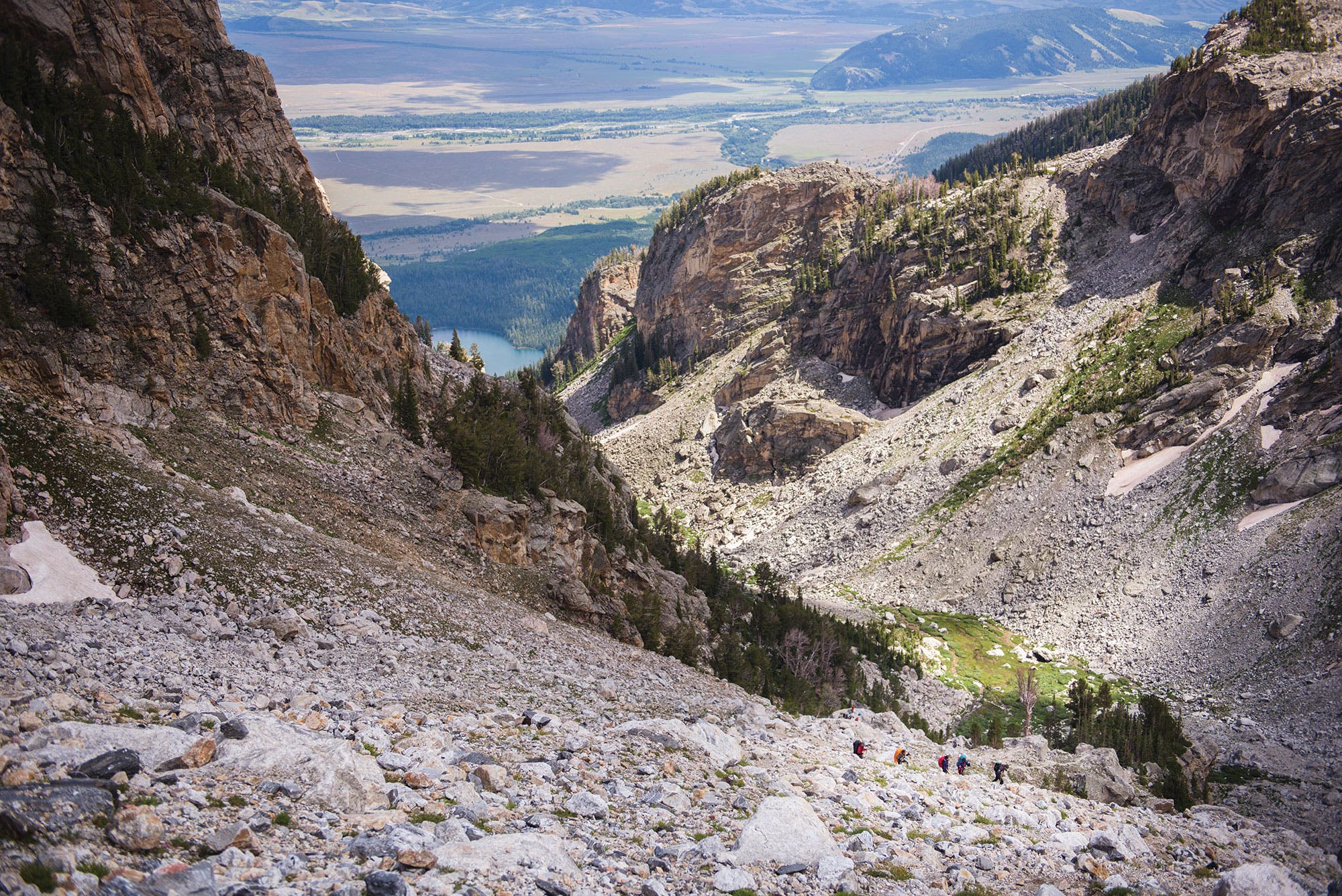 Distant hikers navigate the scree fields of Garnet Canyon on their summit bid for the Grand.
