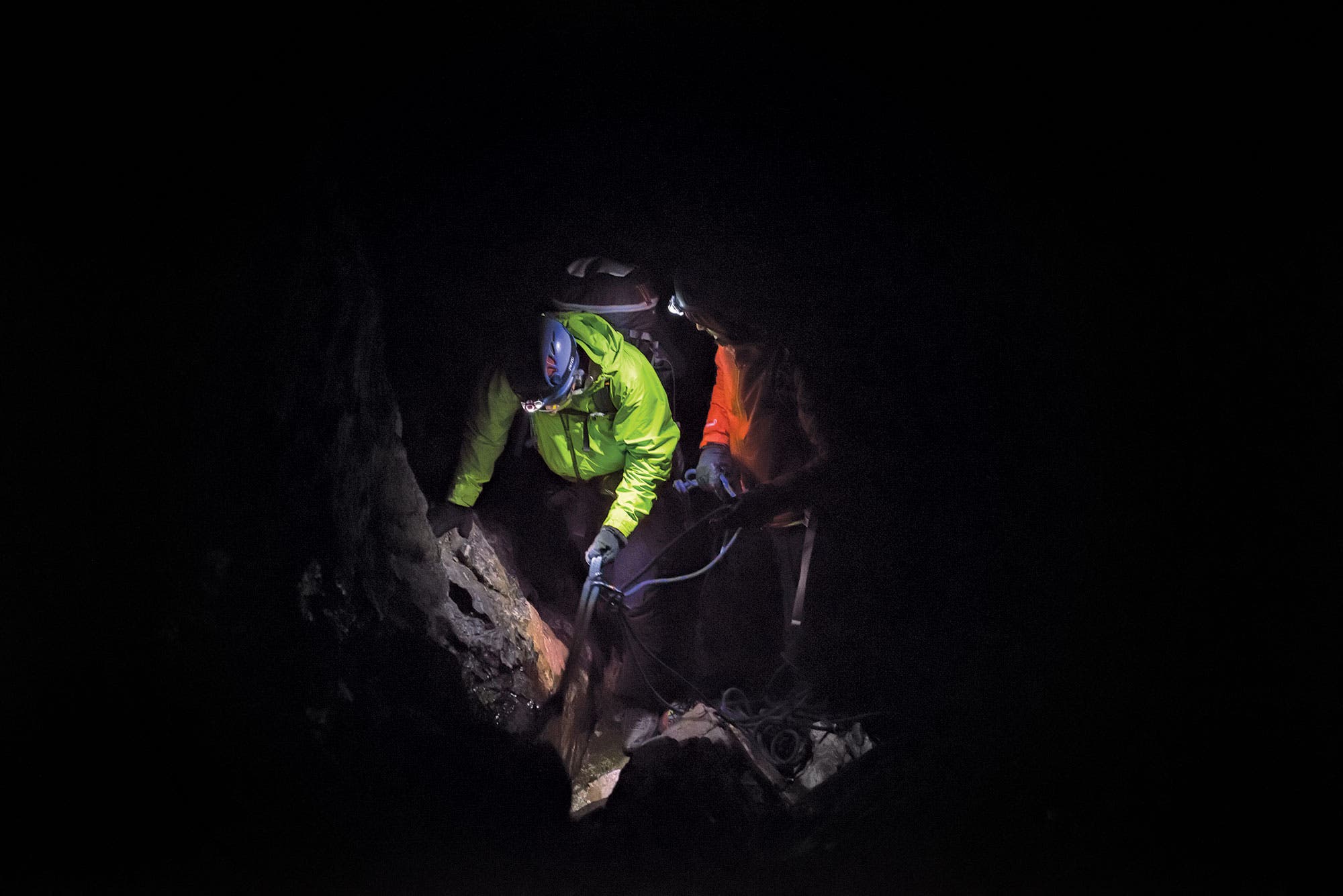 Grand Teton climbers start the day hiking with headlamps through the dark. 