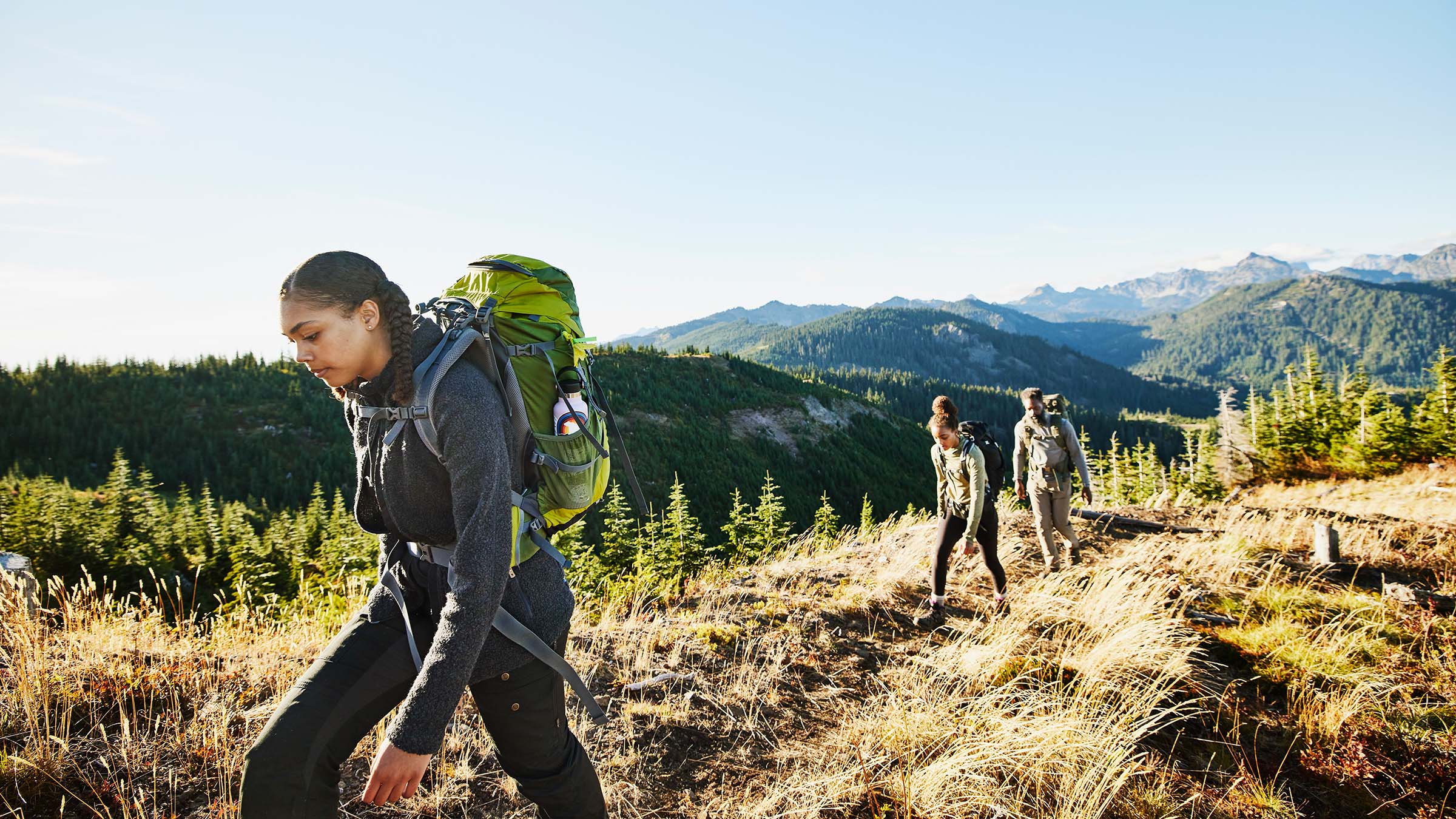 family hiking on trail