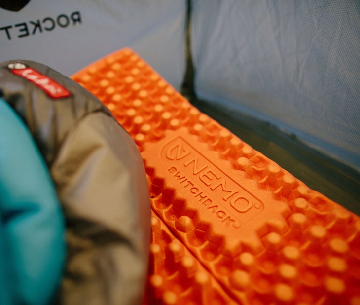 3600_SWITCHBACK_beauty Nemo Switchback sleeping pad in a tent with a sleeping bag on top.