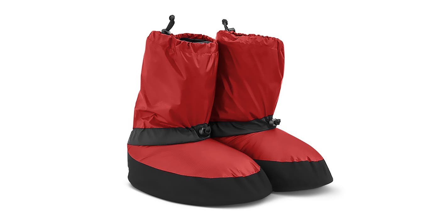 Red and black down booties from Feathered Friends sit on a white background.