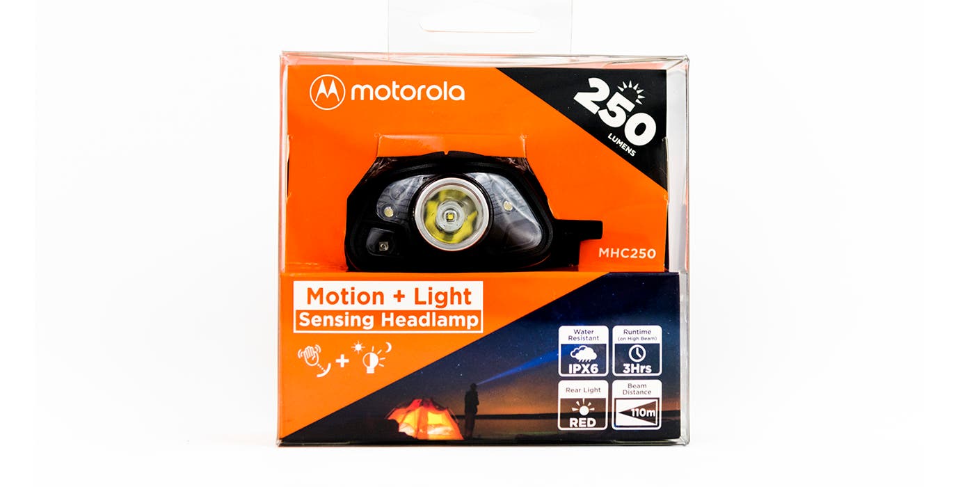 MHC250_Front Motorola motion and light sensing 250 lumen headlamp packaging is featured on a white background. Package is orange with image of headlamp and a…