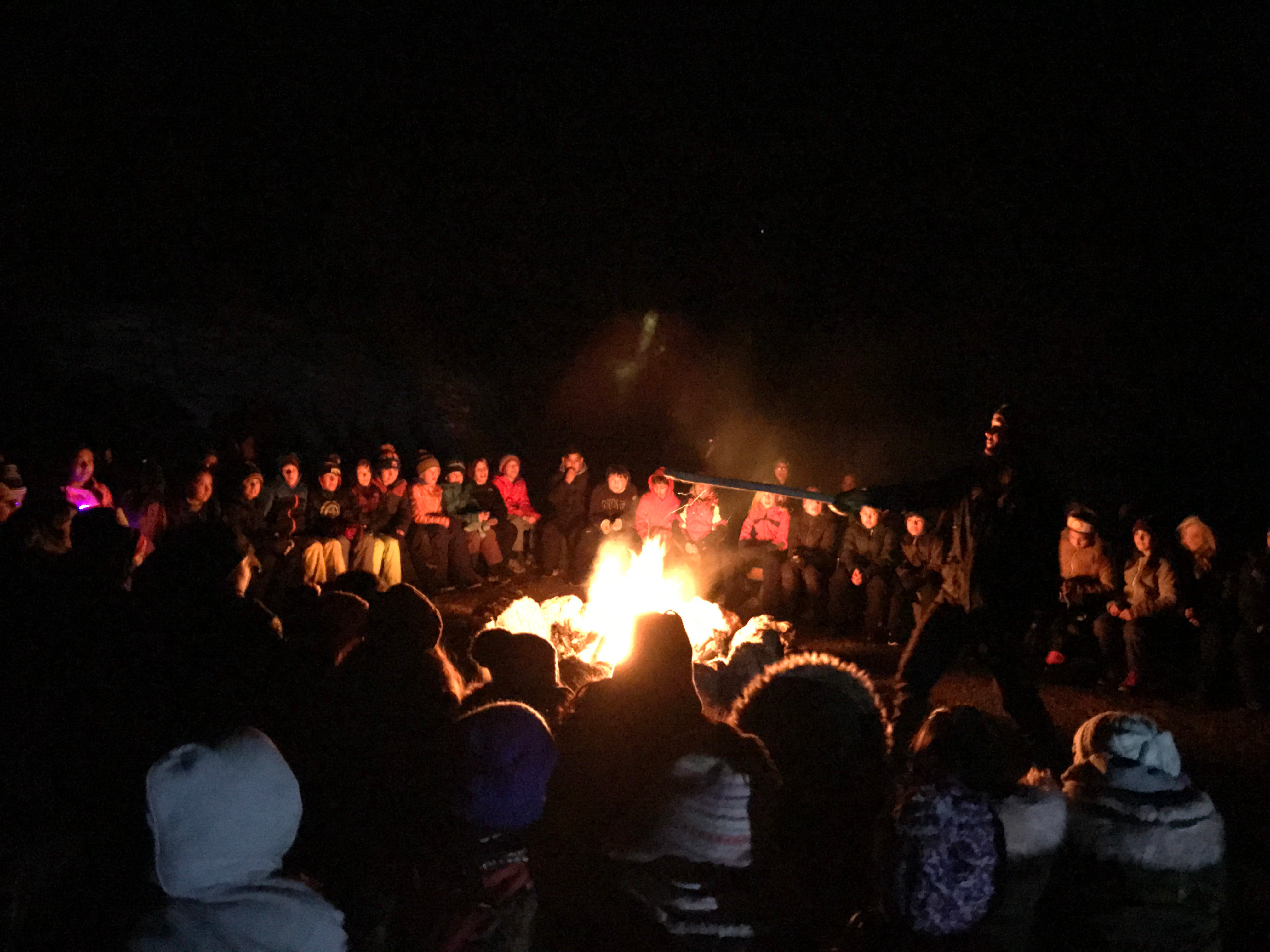 "Fifth-graders mesmerized by the fire and camp in general."