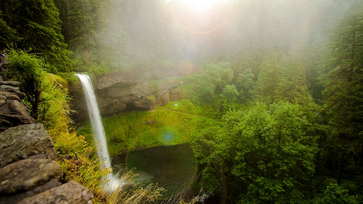 waterfall on green cliff