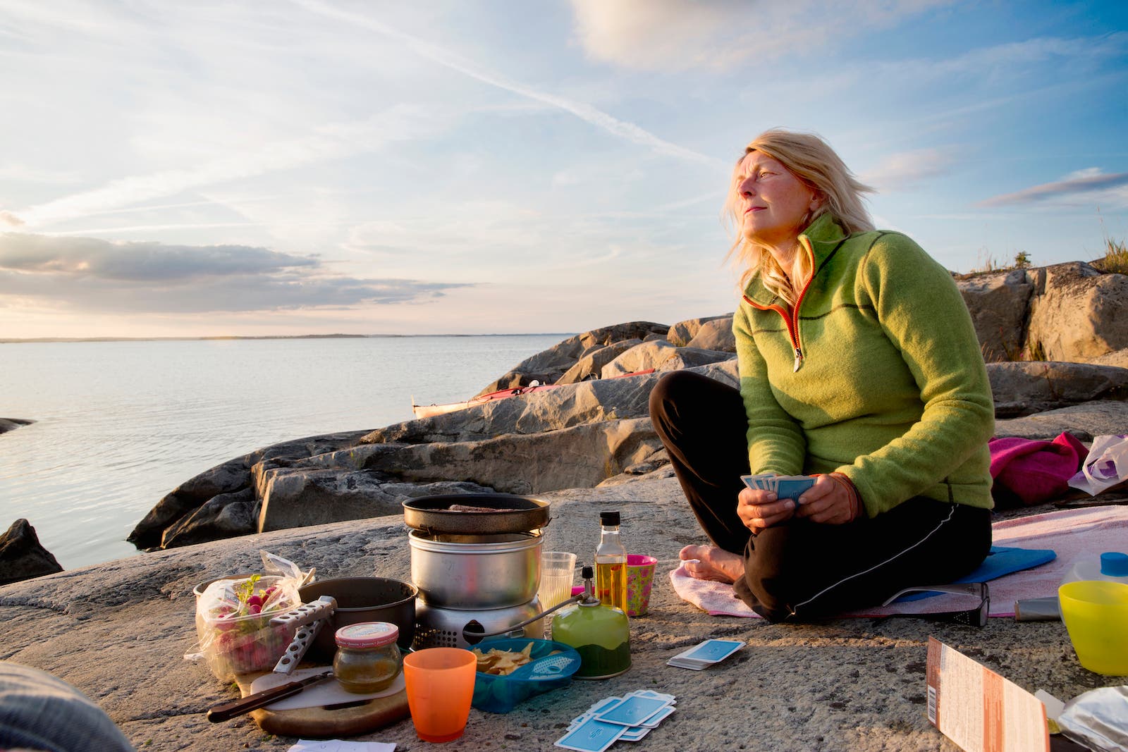 woman cooking and playing card games
