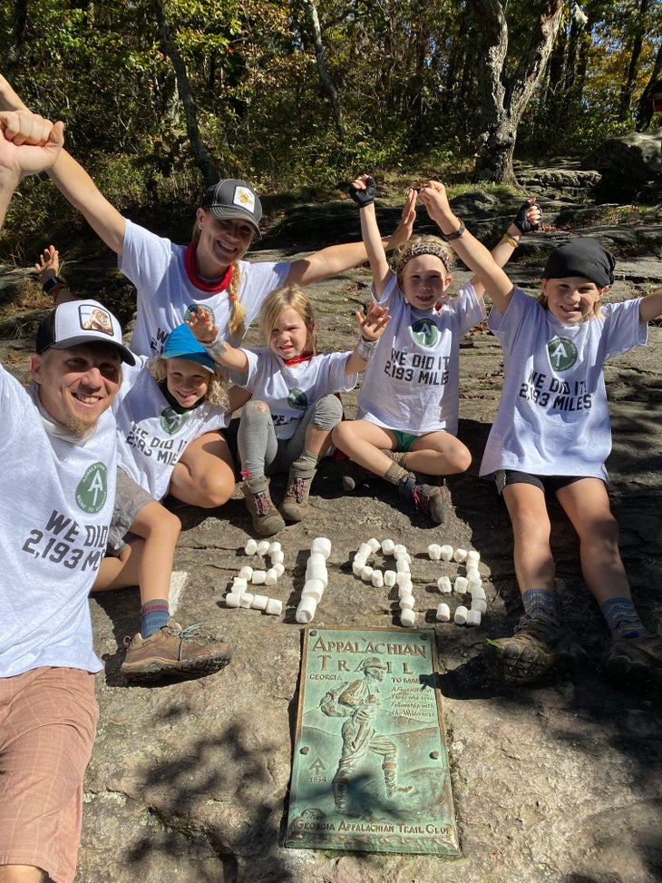 celebrating at finish line hiker family celebrating