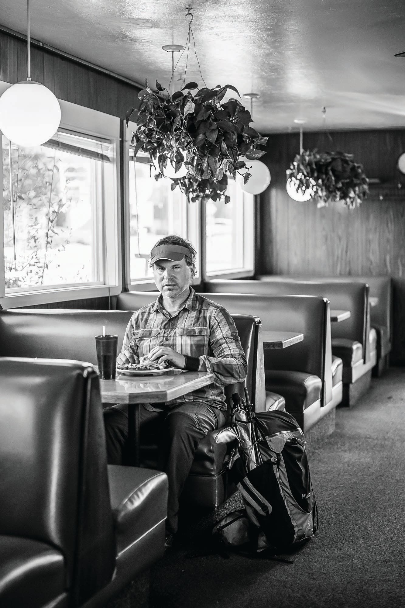 JanFeb21Feat_RUE_201104MHP56_bjk Hiker Rue McKenrick sitting in a diner