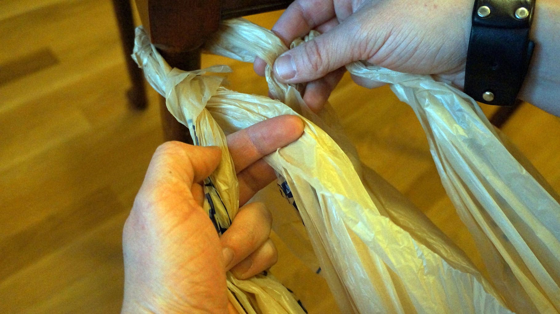 Plastic Bags: Step 12 In your left hand, fold the right over left.