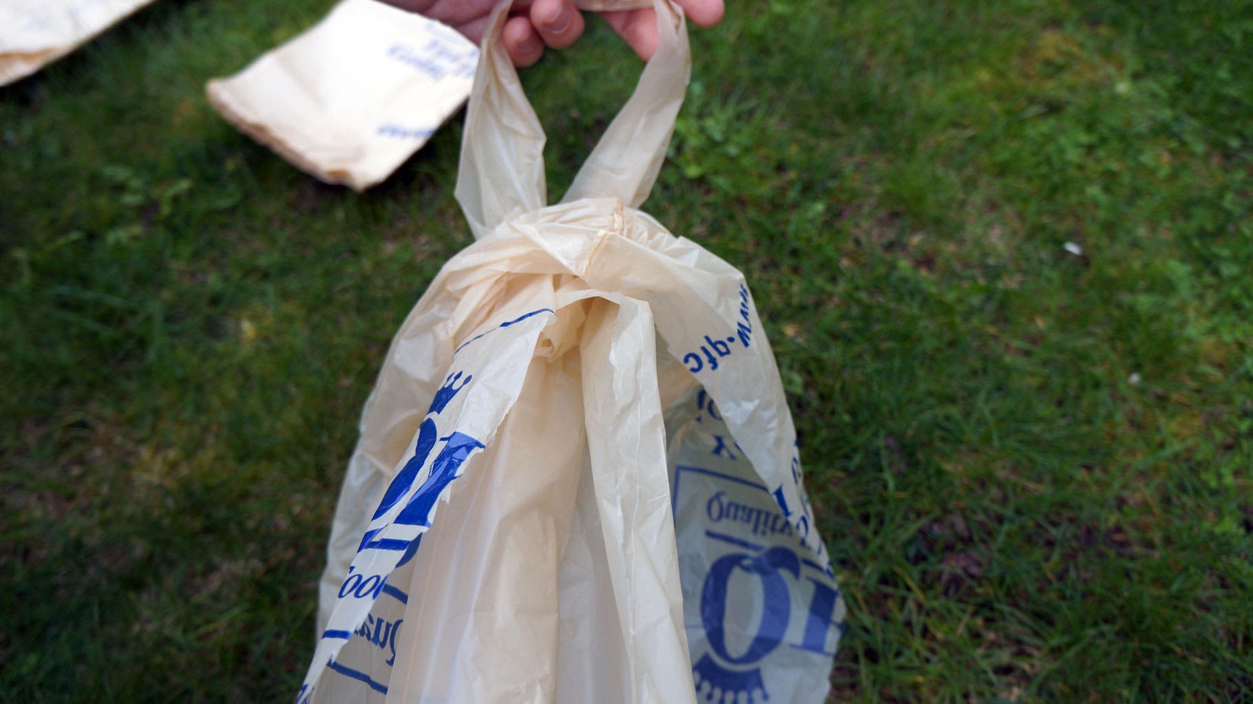 Plastic Bags: Step 6 Now begin connecting half-bags to make strands. Open one and poke a hole near the bottom seam on the side of the half-bag.