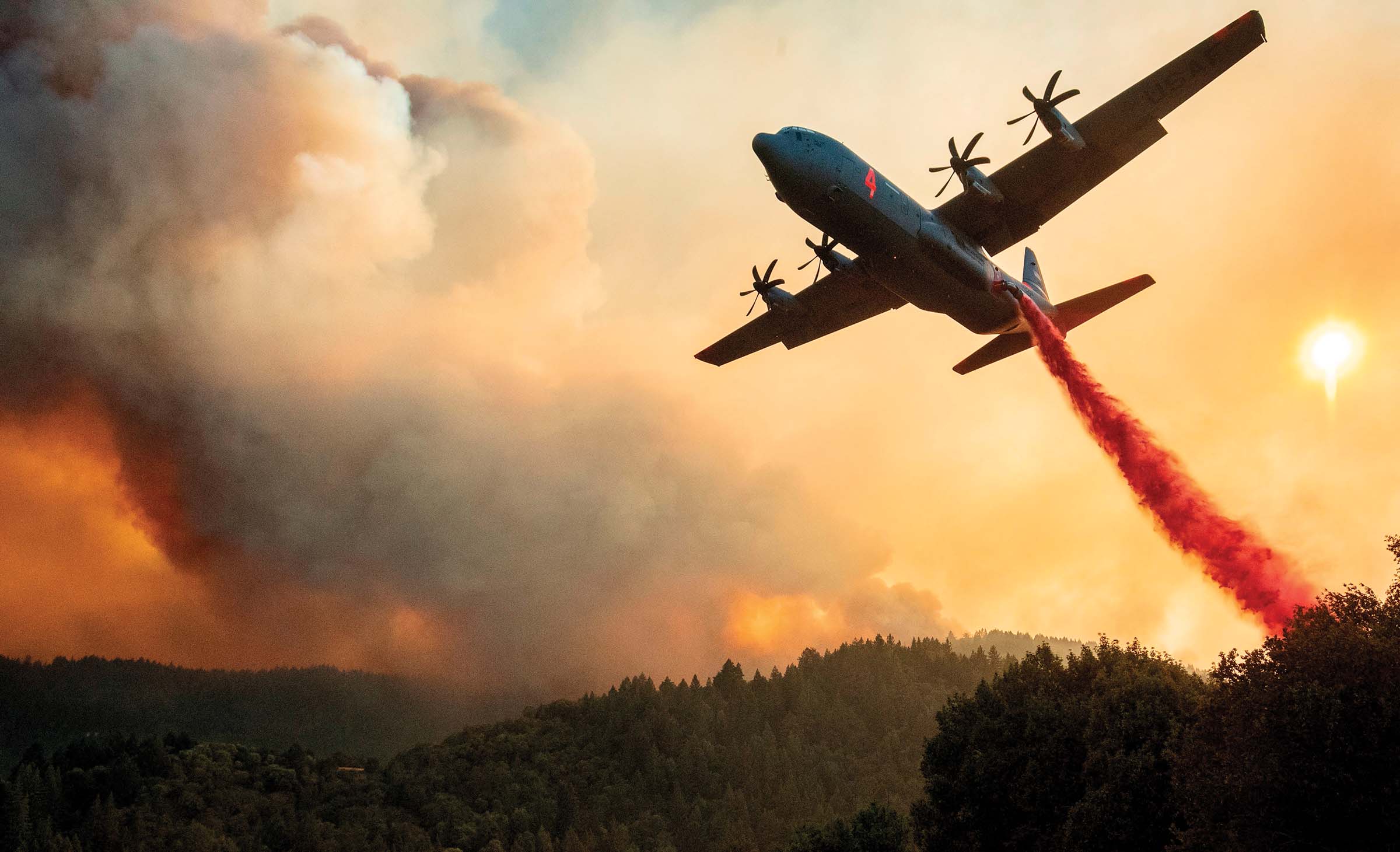plane dropping fire retardant