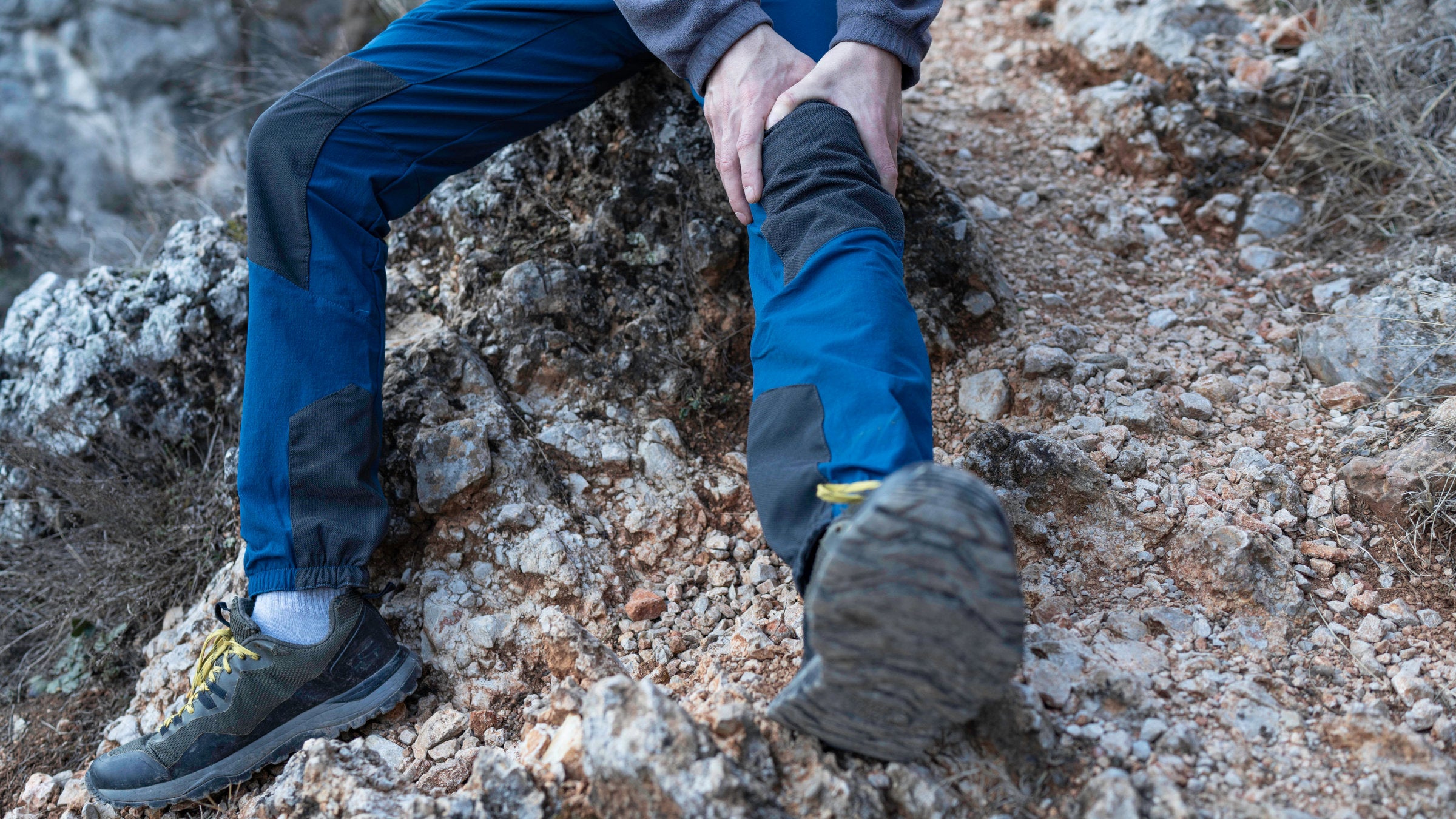 Hiker grabbing leg
