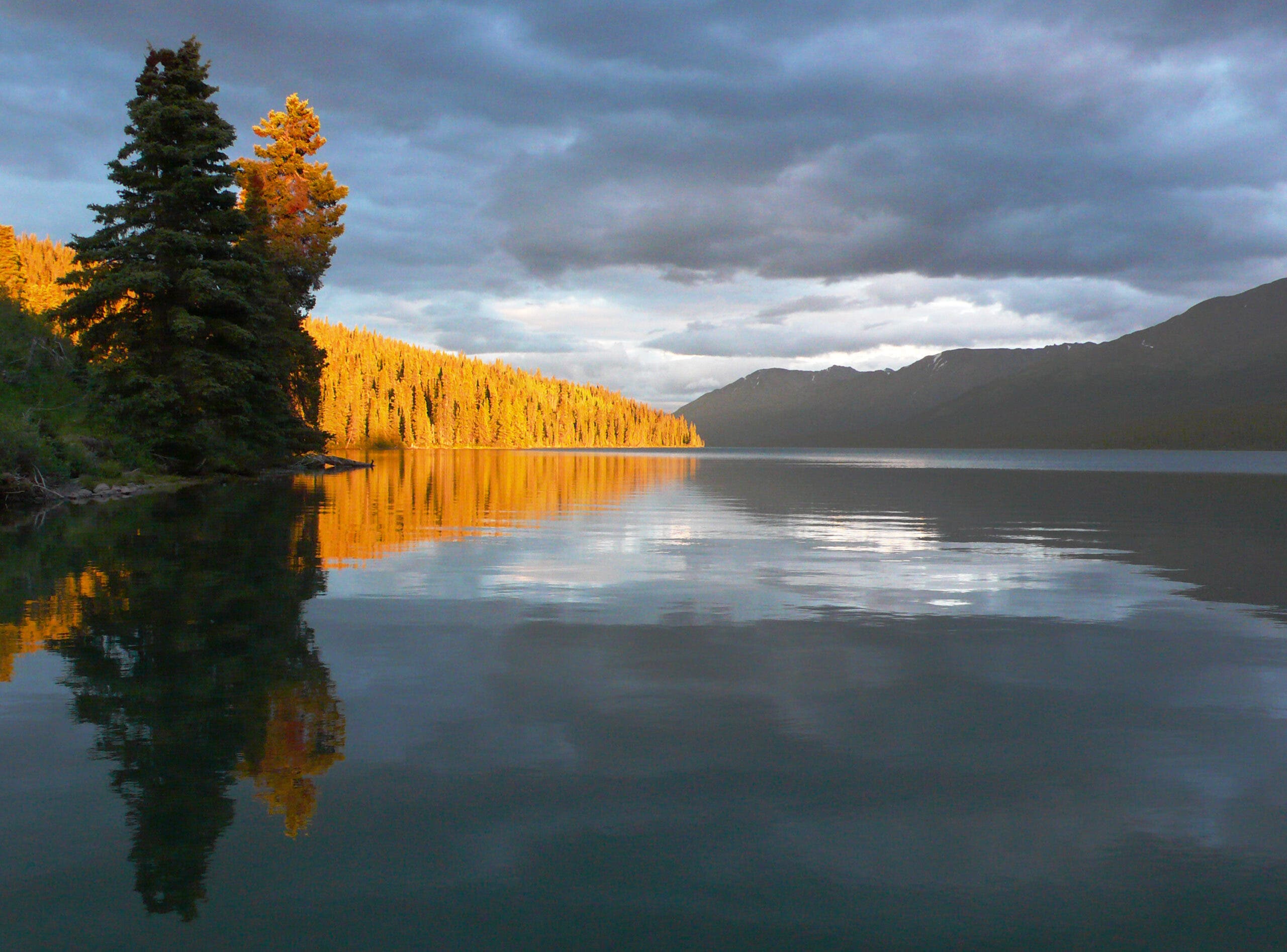 a long lake with hills to either side at dusk