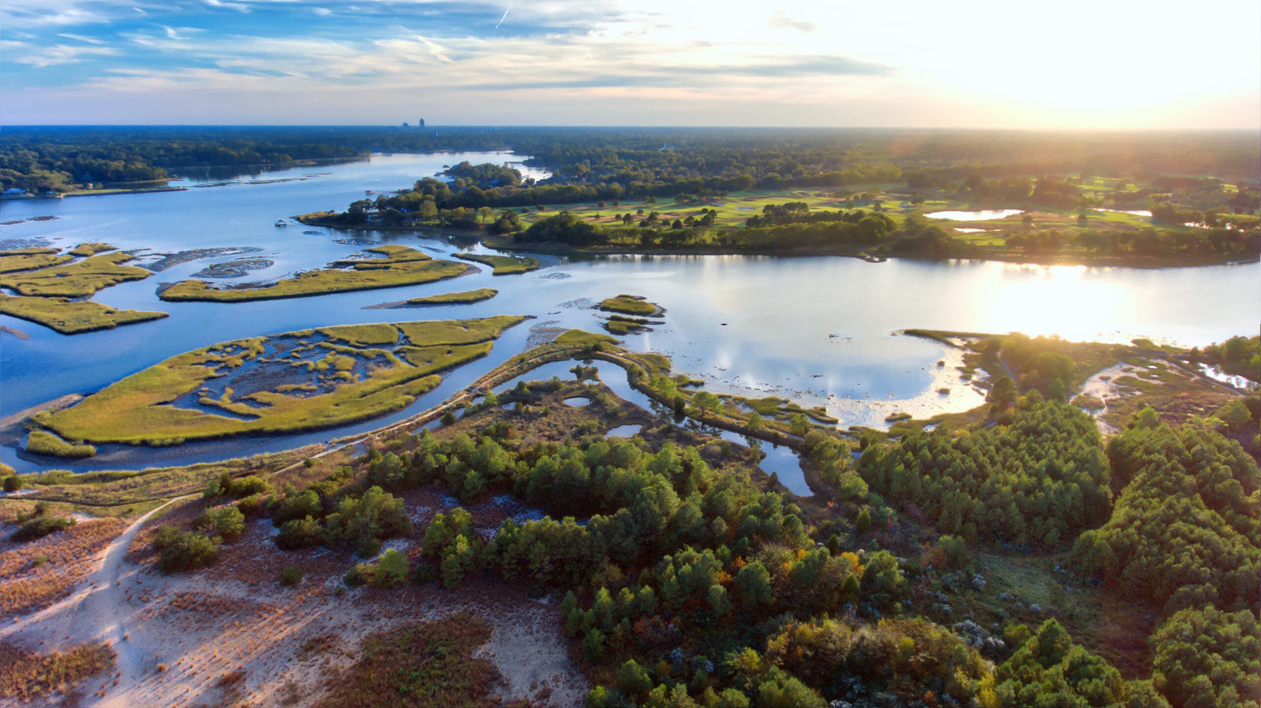 aerial view of wetlands and estuary around a river