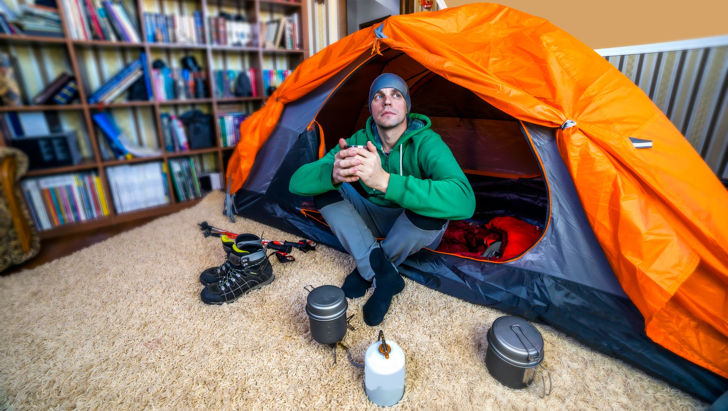 man camping indoors during covid