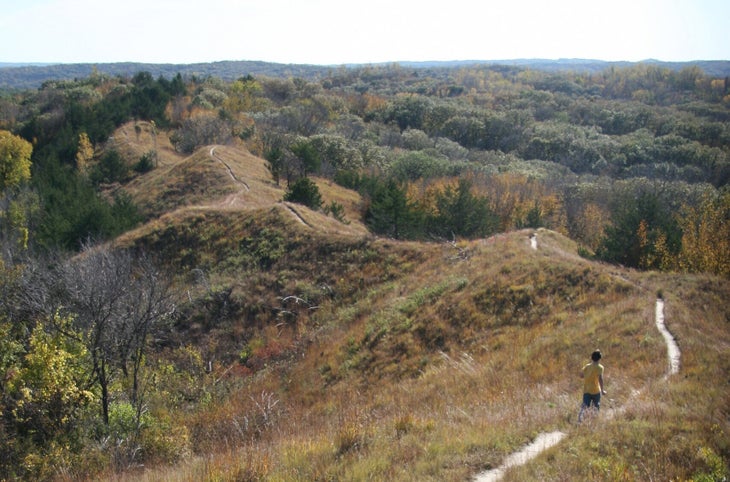 hiker on a ridgetop trail in the Loess Hills