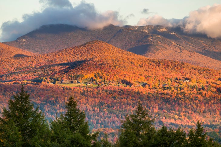 "Fall foliage landscape with Mt. Mansfield in the background, Stowe, Vermont, USA"