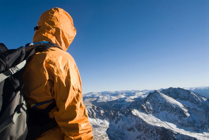 hiker wearing hardshell jacket