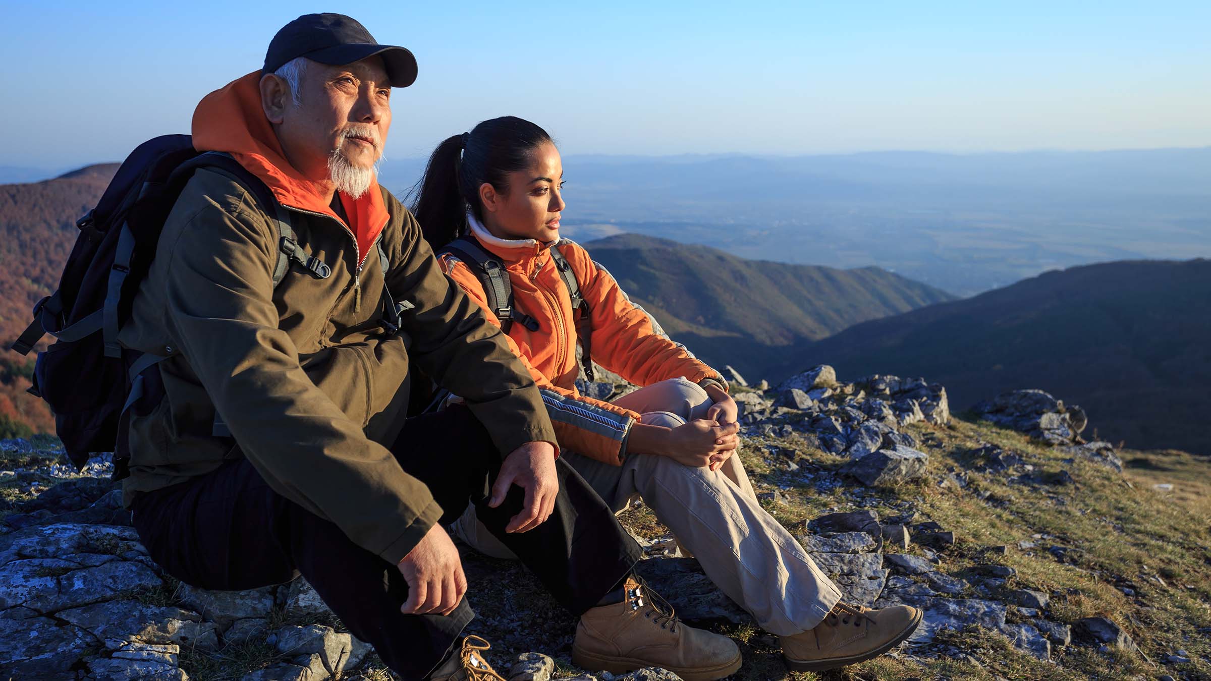 old and young hiker on mountain