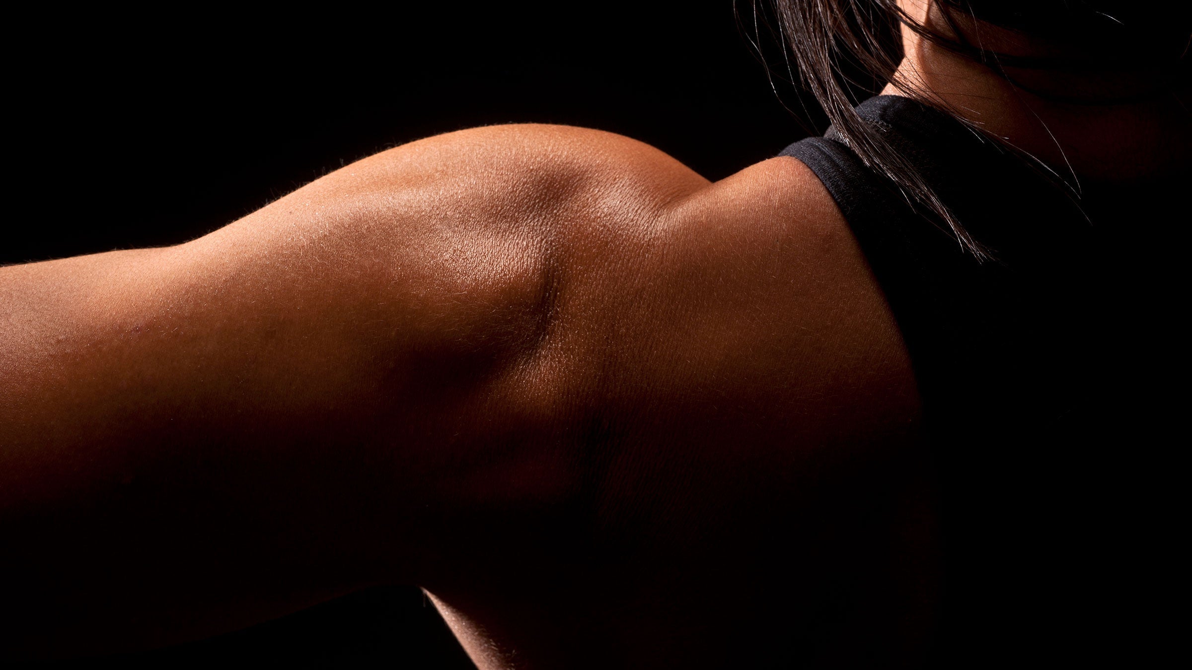 A close-up of a woman's shoulder muscles