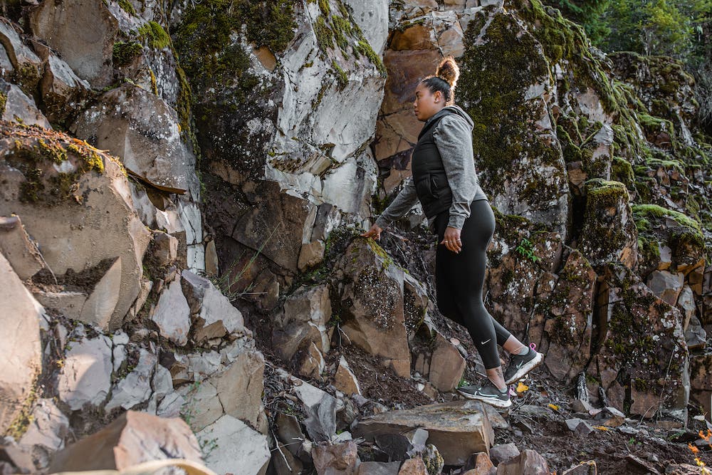 woman doing calf raises outside