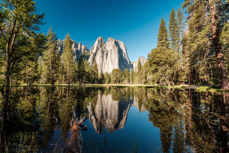 Middle Cathedral Rock reflecting in Merced River at Yosemite