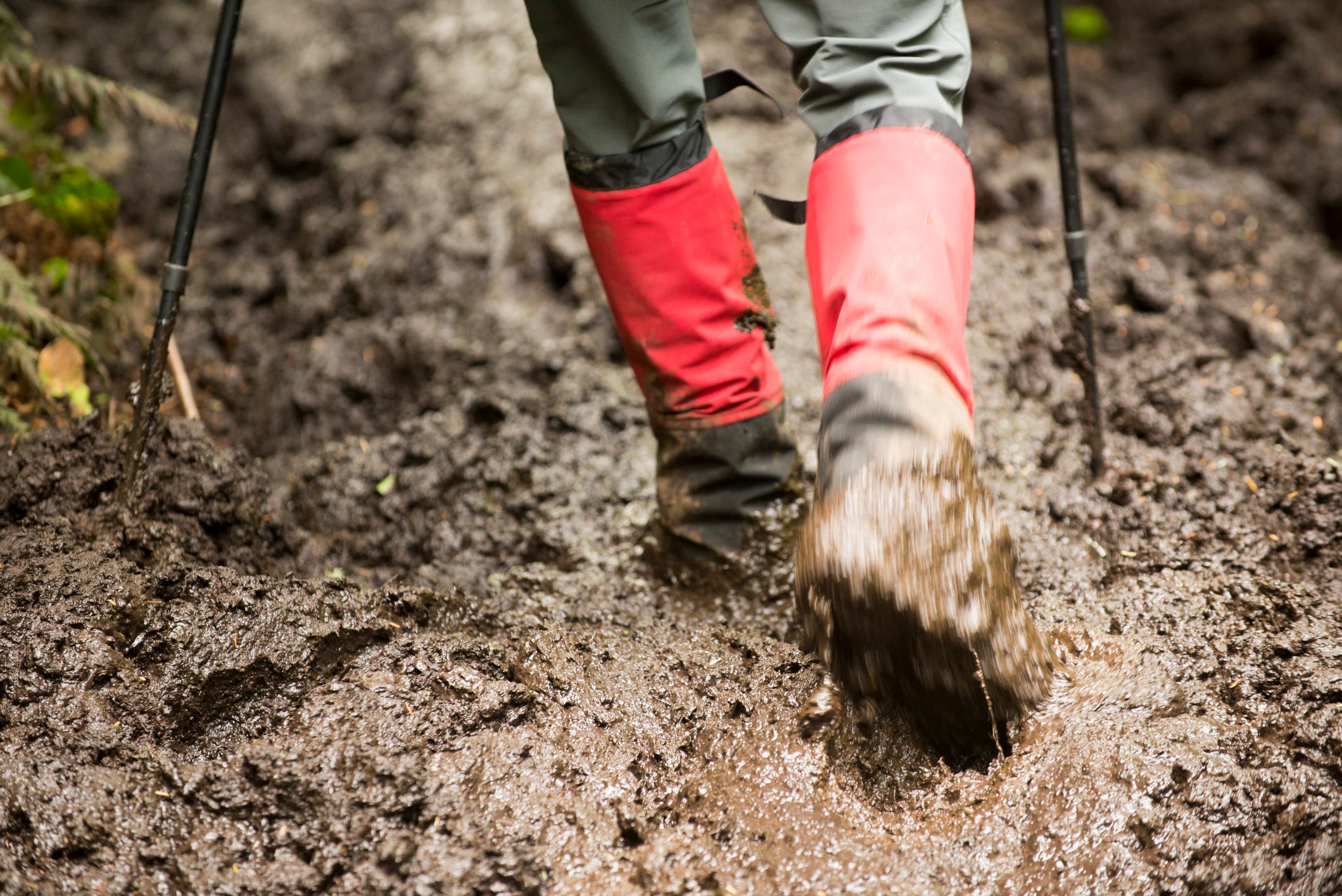 Muddy boots with gaiters.