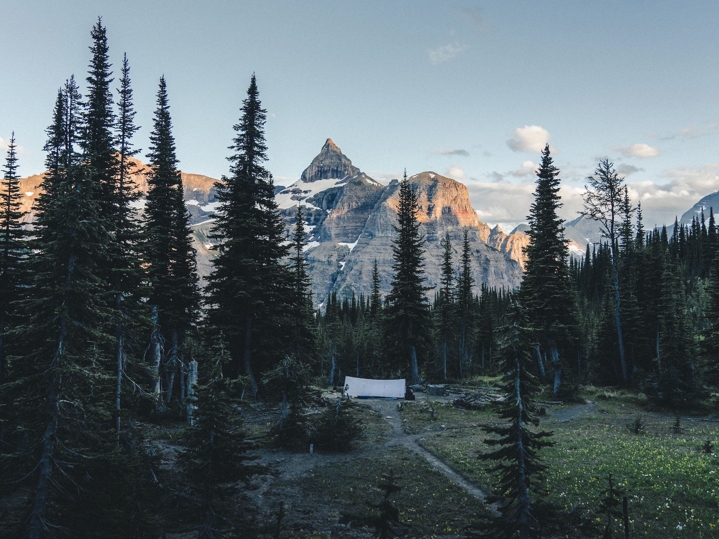 With alpine glow as a nightlight, we set up next to a mosquito-filled pool of snowmelt and bid Glacier goodbye.
