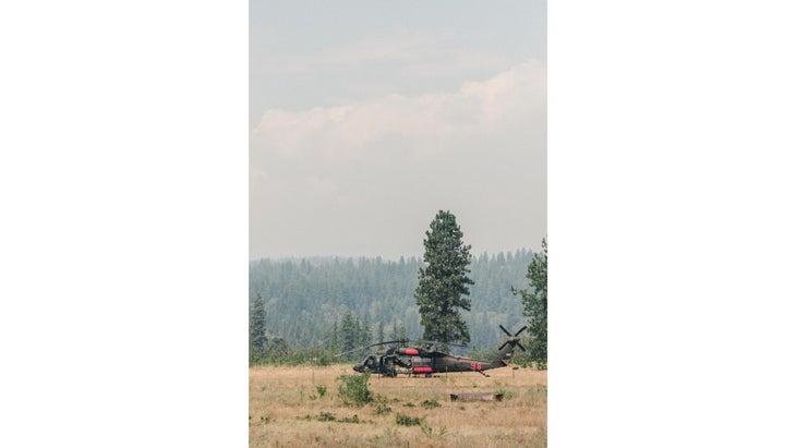 As we exited on the recommended detour, we passed a fire camp and snapped this picture of a pilot resting in his helo.