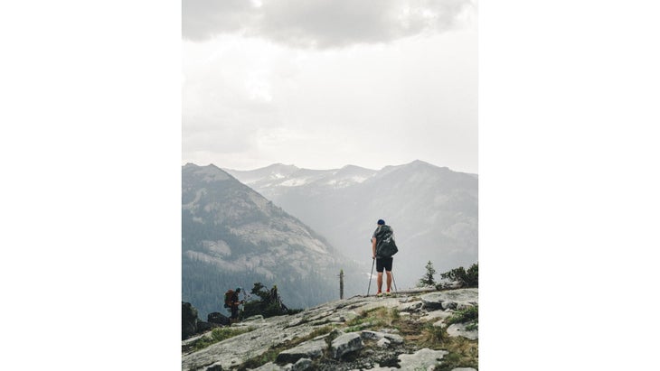 Between a scramble and bushwhack, we were pinned near the base of Lionshead Peak as lightning crackled and cliffs obscured a safe route down.