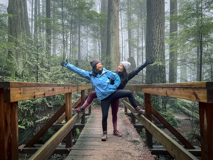 https://cdn.backpacker.com/wp-content/uploads/2022/03/two-women-on-bridge.jpg?width=730