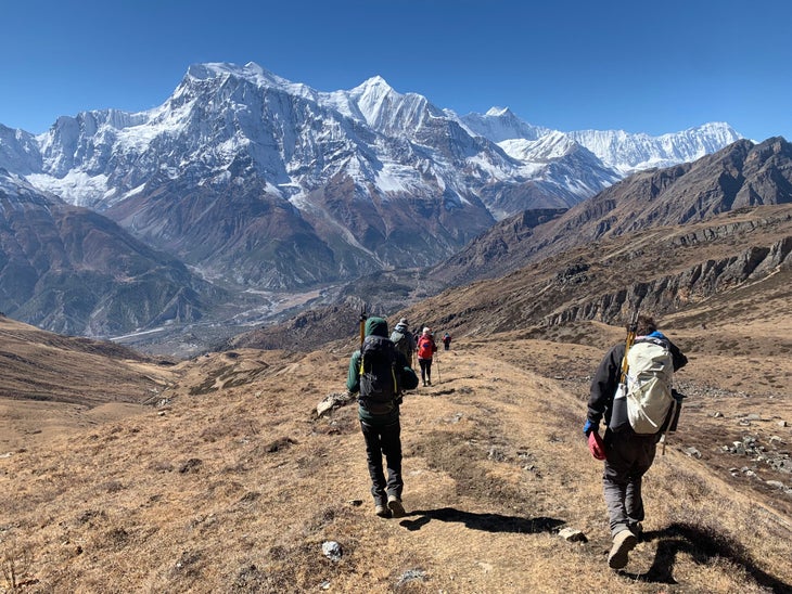 Hikers descending from Kang La Pass