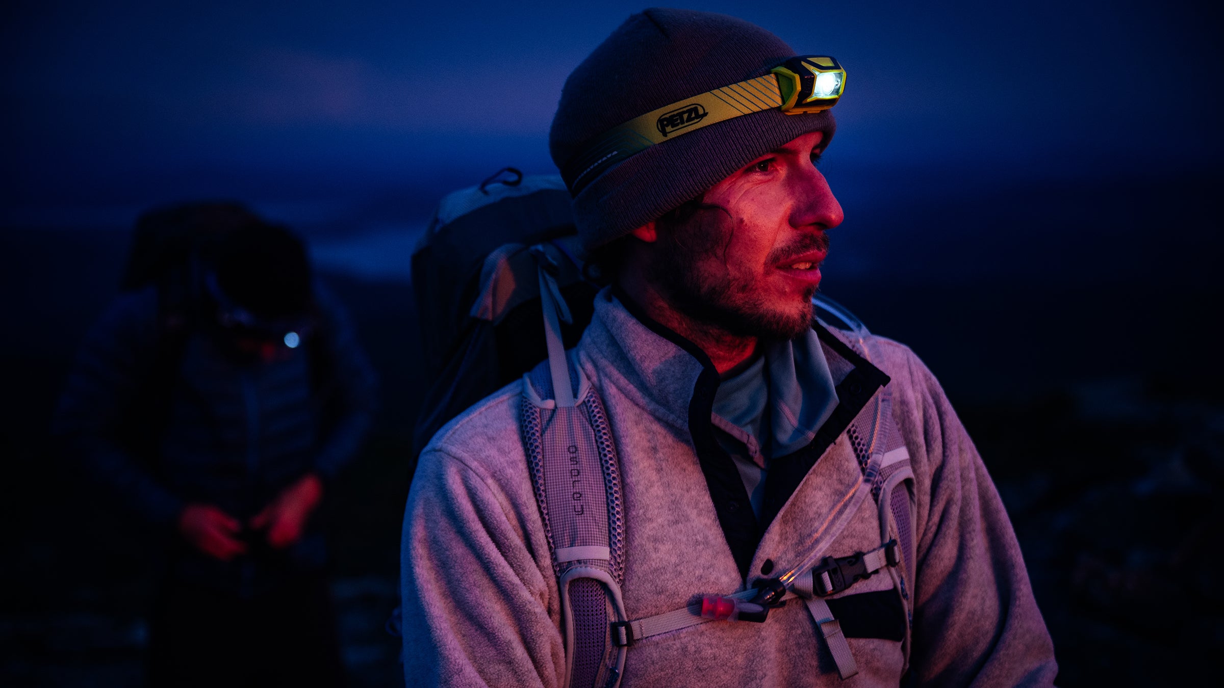 man with a headlamp on at night