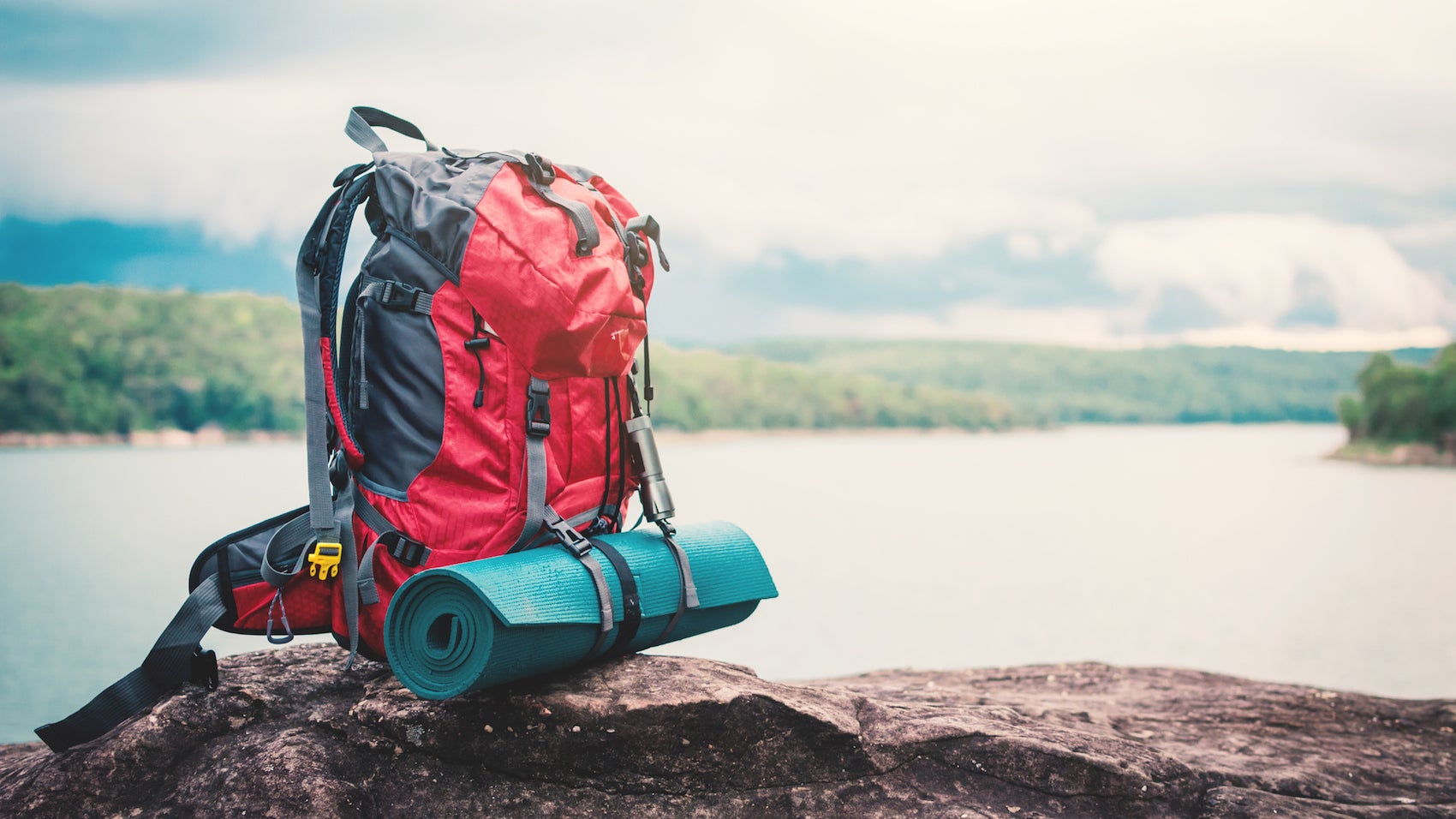 Close-Up Of Hiking Backpack On Rock By Lake