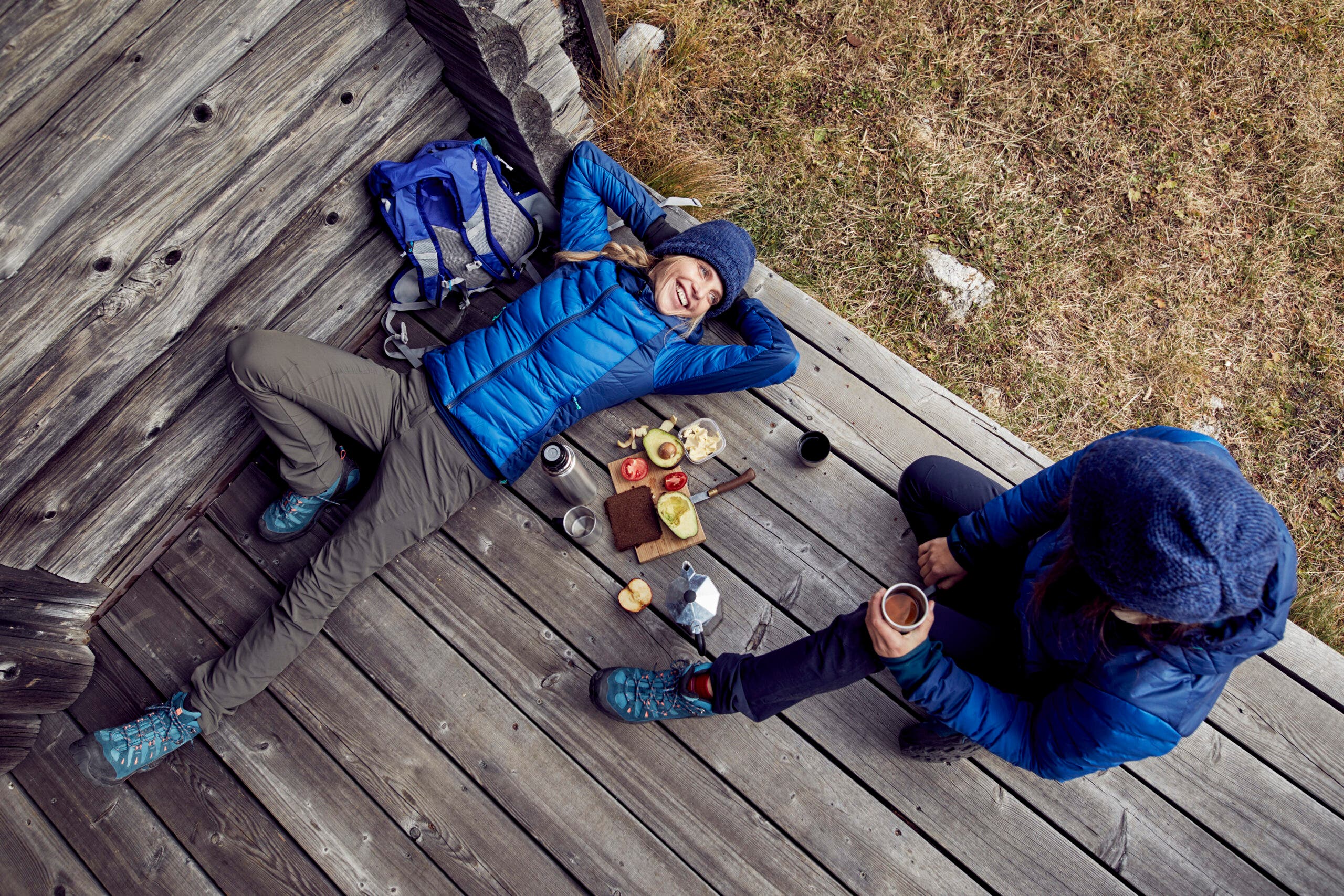 camping breakfast ideas: two hikers eating breakfast charcuterie