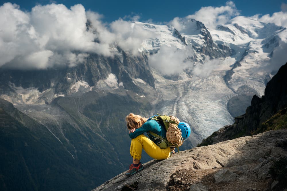Young woman sitting down tired on a hike
